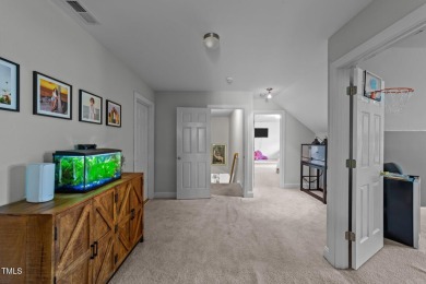 This stunning 5-bedroom, 4-bath home offers luxurious living on on The Neuse Golf Club in North Carolina - for sale on GolfHomes.com, golf home, golf lot