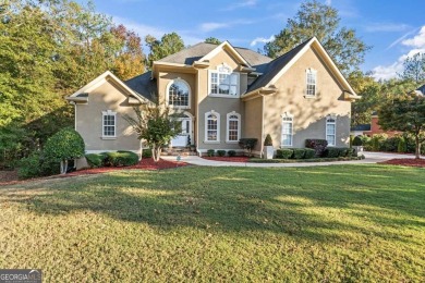 Experience luxury living at its finest in this custom-built home on Eagles Landing Country Club in Georgia - for sale on GolfHomes.com, golf home, golf lot