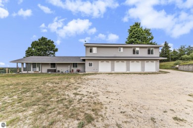 Stunning 3-bedroom, 3-bath gem sits on 2 picturesque acres and on The Briar At Mesick Golf and Country Club in Michigan - for sale on GolfHomes.com, golf home, golf lot