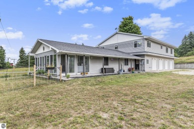 Stunning 3-bedroom, 3-bath gem sits on 2 picturesque acres and on The Briar At Mesick Golf and Country Club in Michigan - for sale on GolfHomes.com, golf home, golf lot