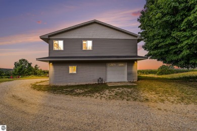 Stunning 3-bedroom, 3-bath gem sits on 2 picturesque acres and on The Briar At Mesick Golf and Country Club in Michigan - for sale on GolfHomes.com, golf home, golf lot