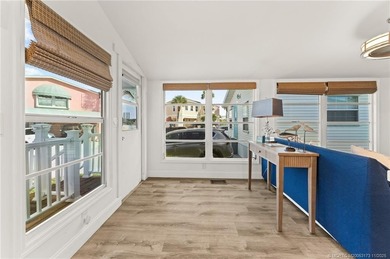 Charming and renovated is this 2 bedroom 1 bathroom getaway in on Island Dunes Country Club in Florida - for sale on GolfHomes.com, golf home, golf lot