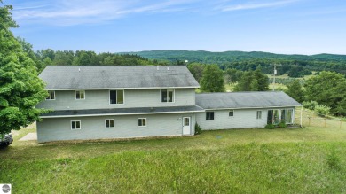 Stunning 3-bedroom, 3-bath gem sits on 2 picturesque acres and on The Briar At Mesick Golf and Country Club in Michigan - for sale on GolfHomes.com, golf home, golf lot