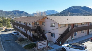 Wake up to mountain views and fresh alpine air in this 2-bedroom on Lake Estes Golf Course in Colorado - for sale on GolfHomes.com, golf home, golf lot