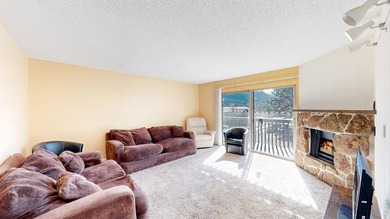 Wake up to mountain views and fresh alpine air in this 2-bedroom on Lake Estes Golf Course in Colorado - for sale on GolfHomes.com, golf home, golf lot