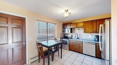 Wake up to mountain views and fresh alpine air in this 2-bedroom on Lake Estes Golf Course in Colorado - for sale on GolfHomes.com, golf home, golf lot