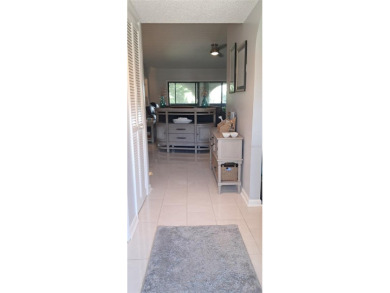 Step into this spacious, beautifully renovated, end-unit condo on Lake Wales Country Club in Florida - for sale on GolfHomes.com, golf home, golf lot