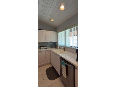Step into this spacious, beautifully renovated, end-unit condo on Lake Wales Country Club in Florida - for sale on GolfHomes.com, golf home, golf lot