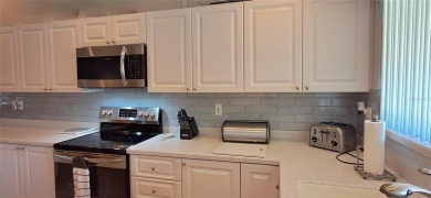 Step into this spacious, beautifully renovated, end-unit condo on Lake Wales Country Club in Florida - for sale on GolfHomes.com, golf home, golf lot