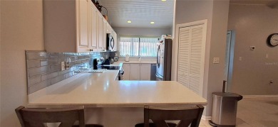 Step into this spacious, beautifully renovated, end-unit condo on Lake Wales Country Club in Florida - for sale on GolfHomes.com, golf home, golf lot