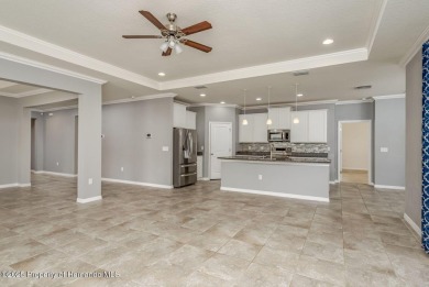 Welcome to this beautifully maintained 4-bedroom, 3.5-bathroom on Silverthorn Country Club in Florida - for sale on GolfHomes.com, golf home, golf lot