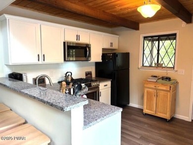 This simply sweet chalet getaway is nestled on a pretty forested on The Hideout Golf in Pennsylvania - for sale on GolfHomes.com, golf home, golf lot
