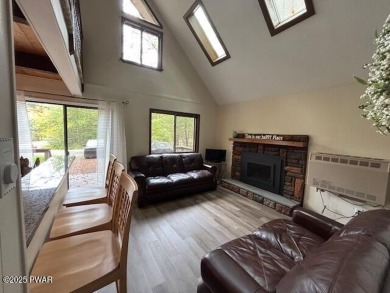 This simply sweet chalet getaway is nestled on a pretty forested on The Hideout Golf in Pennsylvania - for sale on GolfHomes.com, golf home, golf lot