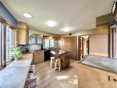 Privately set on a quiet drive, this Colorado-style home offers on Prairie Dunes Country Club in Kansas - for sale on GolfHomes.com, golf home, golf lot