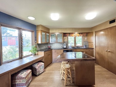 Privately set on a quiet drive, this Colorado-style home offers on Prairie Dunes Country Club in Kansas - for sale on GolfHomes.com, golf home, golf lot