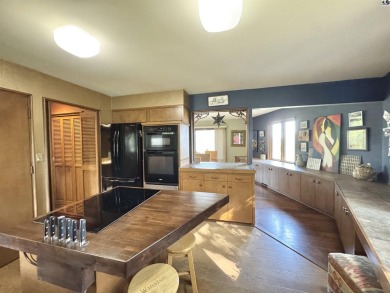 Privately set on a quiet drive, this Colorado-style home offers on Prairie Dunes Country Club in Kansas - for sale on GolfHomes.com, golf home, golf lot