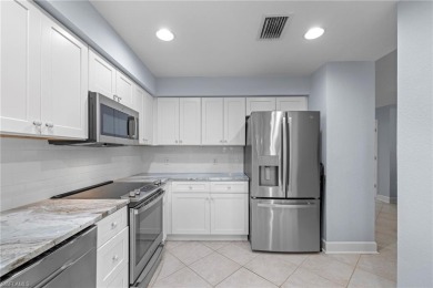 First time ever offered, this stunning and completely remodeled on West Bay Beach and Golf Club in Florida - for sale on GolfHomes.com, golf home, golf lot
