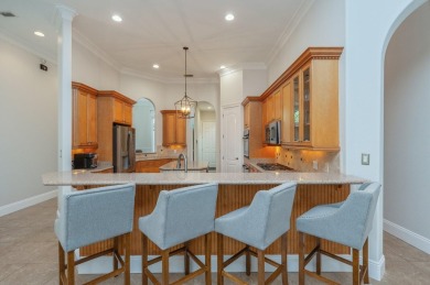 Luxurious family living all on one level in the esteemed gated on Regatta Bay Golf and Country Club in Florida - for sale on GolfHomes.com, golf home, golf lot