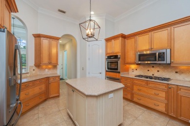 Luxurious family living all on one level in the esteemed gated on Regatta Bay Golf and Country Club in Florida - for sale on GolfHomes.com, golf home, golf lot