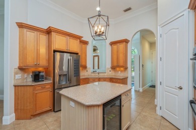 Luxurious family living all on one level in the esteemed gated on Regatta Bay Golf and Country Club in Florida - for sale on GolfHomes.com, golf home, golf lot