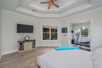 Luxurious family living all on one level in the esteemed gated on Regatta Bay Golf and Country Club in Florida - for sale on GolfHomes.com, golf home, golf lot