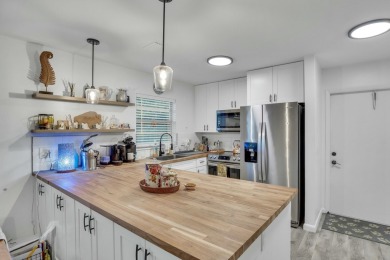 Remarkably renovated 1st floor corner unit located in Vista on Vero Beach South Golf Course in Florida - for sale on GolfHomes.com, golf home, golf lot