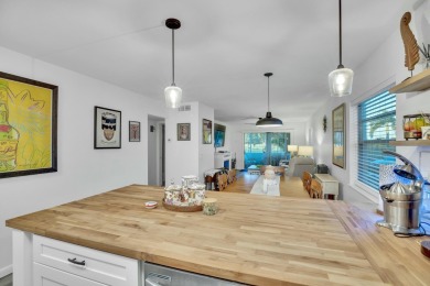Remarkably renovated 1st floor corner unit located in Vista on Vero Beach South Golf Course in Florida - for sale on GolfHomes.com, golf home, golf lot