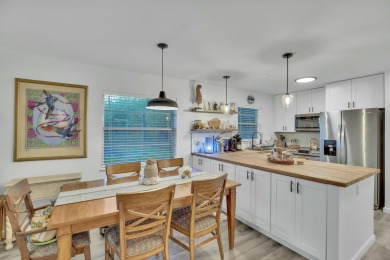 Remarkably renovated 1st floor corner unit located in Vista on Vero Beach South Golf Course in Florida - for sale on GolfHomes.com, golf home, golf lot