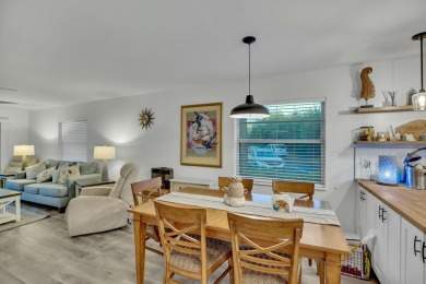 Remarkably renovated 1st floor corner unit located in Vista on Vero Beach South Golf Course in Florida - for sale on GolfHomes.com, golf home, golf lot