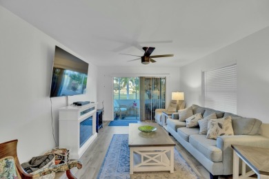 Remarkably renovated 1st floor corner unit located in Vista on Vero Beach South Golf Course in Florida - for sale on GolfHomes.com, golf home, golf lot