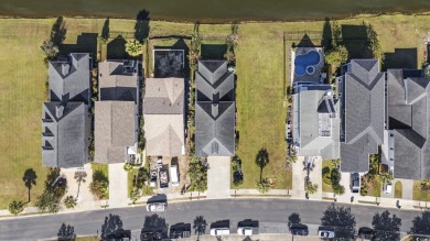 An exceptional four-bedroom, three-and-a-half-bathroom home on Myrtlewood Golf Course and Club  in South Carolina - for sale on GolfHomes.com, golf home, golf lot