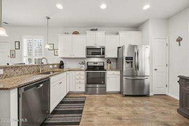 Welcome to 301 Bulkhead Bend, a bright and spacious end-unit in on Carolina Shores Golf Course in North Carolina - for sale on GolfHomes.com, golf home, golf lot