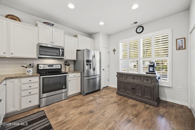 Welcome to 301 Bulkhead Bend, a bright and spacious end-unit in on Carolina Shores Golf Course in North Carolina - for sale on GolfHomes.com, golf home, golf lot