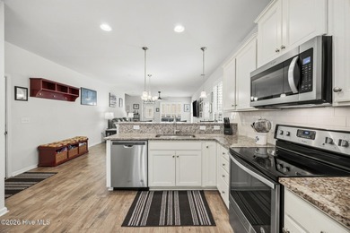 Welcome to 301 Bulkhead Bend, a bright and spacious end-unit in on Carolina Shores Golf Course in North Carolina - for sale on GolfHomes.com, golf home, golf lot