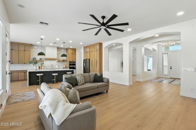 Modern Mountain Living Reimagined.  Discover elevated luxury in on Estrella Mountain Ranch Golf Course in Arizona - for sale on GolfHomes.com, golf home, golf lot