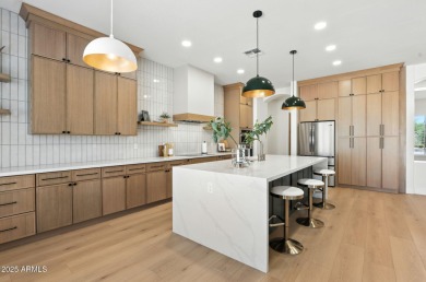 Modern Mountain Living Reimagined.  Discover elevated luxury in on Estrella Mountain Ranch Golf Course in Arizona - for sale on GolfHomes.com, golf home, golf lot