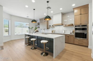 Modern Mountain Living Reimagined.  Discover elevated luxury in on Estrella Mountain Ranch Golf Course in Arizona - for sale on GolfHomes.com, golf home, golf lot