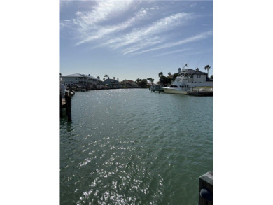 Charming waterfront lot in Port A's premier canal community of on Palmilla Beach Golf Club in Texas - for sale on GolfHomes.com, golf home, golf lot