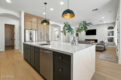Modern Mountain Living Reimagined.  Discover elevated luxury in on Estrella Mountain Ranch Golf Course in Arizona - for sale on GolfHomes.com, golf home, golf lot