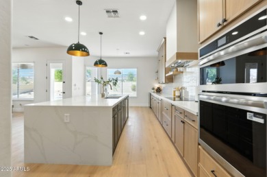 Modern Mountain Living Reimagined.  Discover elevated luxury in on Estrella Mountain Ranch Golf Course in Arizona - for sale on GolfHomes.com, golf home, golf lot