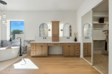 Modern Mountain Living Reimagined.  Discover elevated luxury in on Estrella Mountain Ranch Golf Course in Arizona - for sale on GolfHomes.com, golf home, golf lot