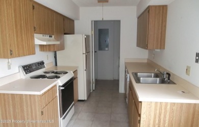 Nice, first floor unit, 2/2 with enclosed porch that overlooks on Heather Golf and Country Club in Florida - for sale on GolfHomes.com, golf home, golf lot