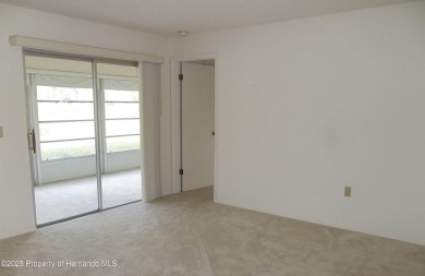 Nice, first floor unit, 2/2 with enclosed porch that overlooks on Heather Golf and Country Club in Florida - for sale on GolfHomes.com, golf home, golf lot