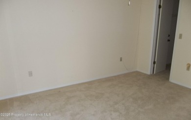 Nice, first floor unit, 2/2 with enclosed porch that overlooks on Heather Golf and Country Club in Florida - for sale on GolfHomes.com, golf home, golf lot