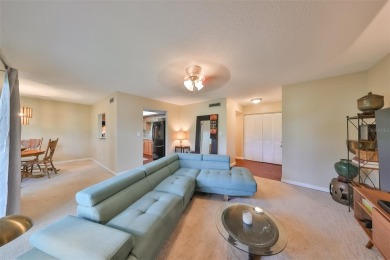 Discover serene and low-maintenance lakeside living in the heart on Clearwater Executive Golf Course in Florida - for sale on GolfHomes.com, golf home, golf lot