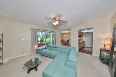 Discover serene and low-maintenance lakeside living in the heart on Clearwater Executive Golf Course in Florida - for sale on GolfHomes.com, golf home, golf lot