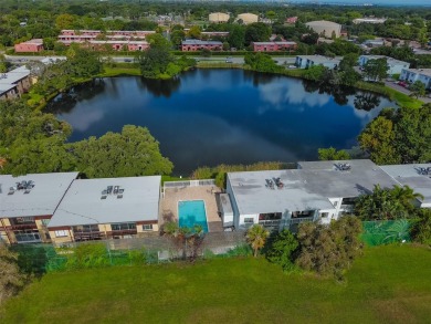 Discover serene and low-maintenance lakeside living in the heart on Clearwater Executive Golf Course in Florida - for sale on GolfHomes.com, golf home, golf lot