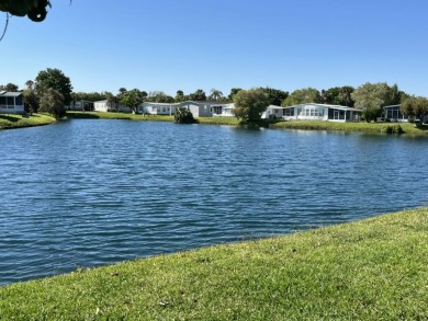 Spacious Lake-Front Garage Home with best view of the lake in on Vista Plantation Golf Club in Florida - for sale on GolfHomes.com, golf home, golf lot