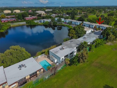 Discover serene and low-maintenance lakeside living in the heart on Clearwater Executive Golf Course in Florida - for sale on GolfHomes.com, golf home, golf lot