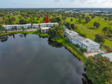 Discover serene and low-maintenance lakeside living in the heart on Clearwater Executive Golf Course in Florida - for sale on GolfHomes.com, golf home, golf lot